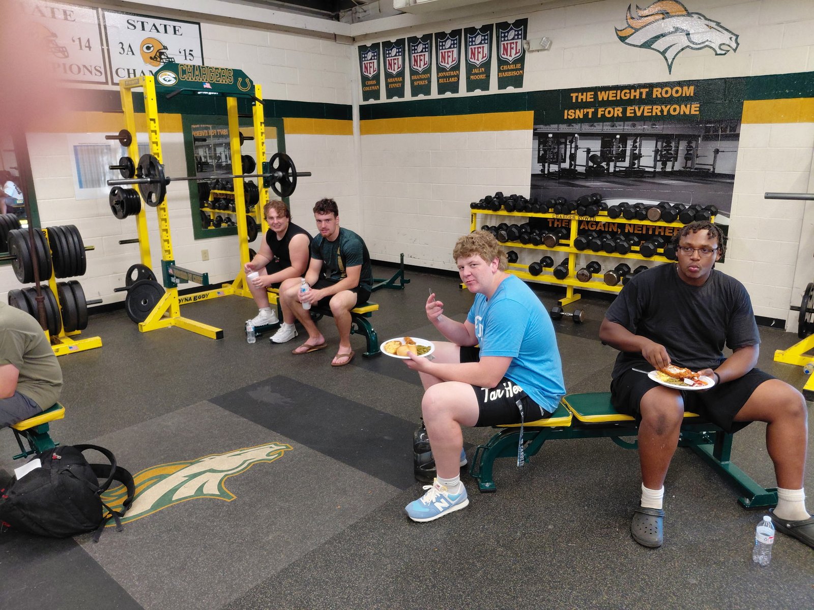 Crest football players eating together after training