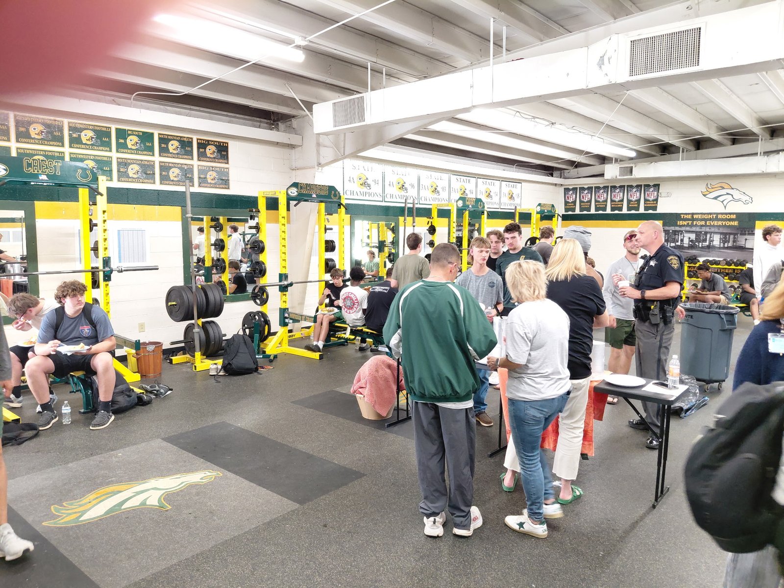 Crest football players and supporters gathered during a provided meal